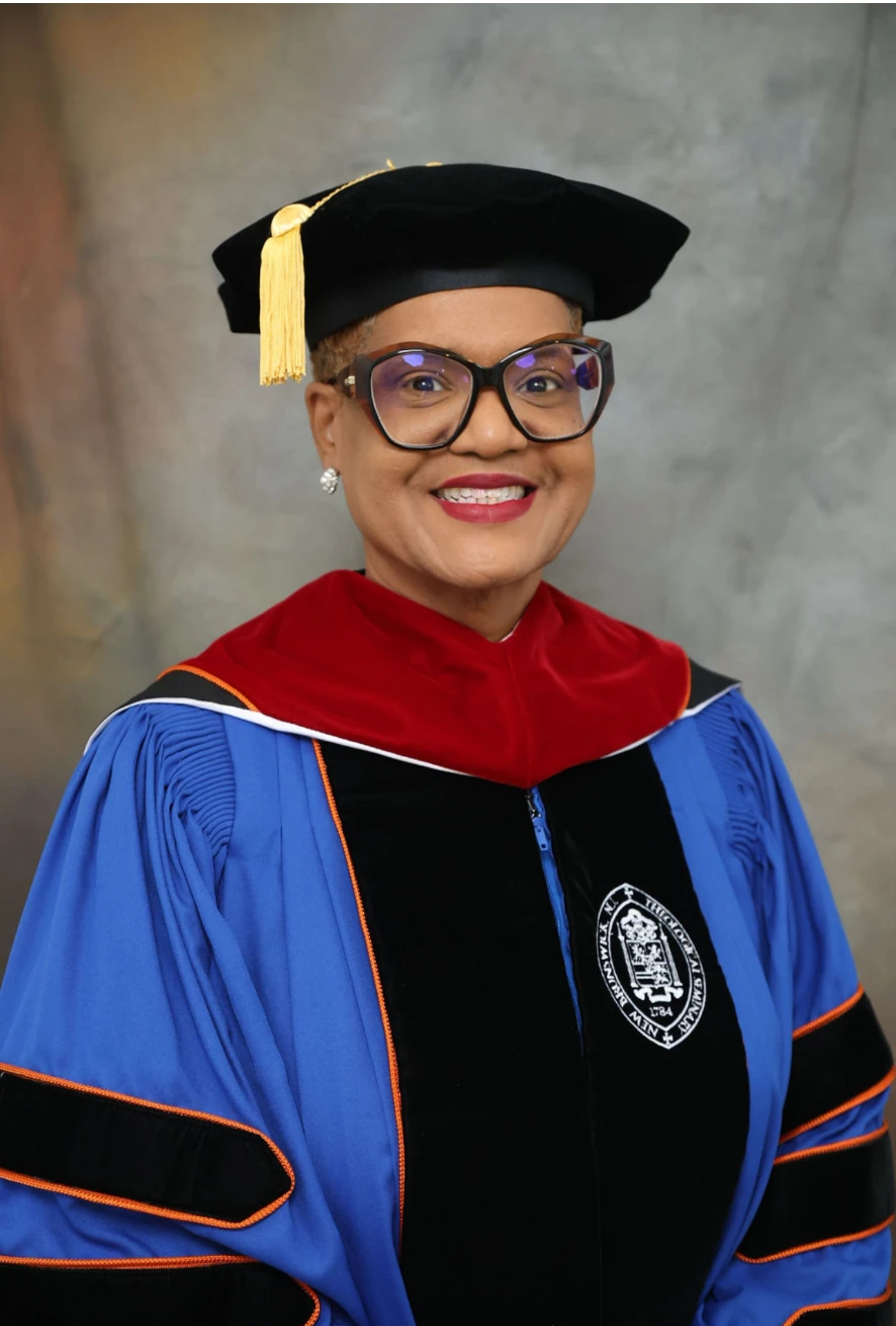 Dr. Lucretia Mason-Underdue in doctoral cap, gown and hood